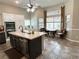 Kitchen with island, stainless appliances, breakfast nook with large window at 3047 Whispering Crest Dr, Henderson, NV 89052
