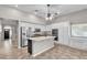 Contemporary kitchen featuring white cabinets, stainless appliances, and an island with a sink at 3047 Whispering Crest Dr, Henderson, NV 89052