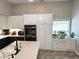 Bright kitchen featuring ample white cabinetry and stainless steel appliances at 3047 Whispering Crest Dr, Henderson, NV 89052