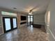 Living room with electric fireplace and large TV at 3047 Whispering Crest Dr, Henderson, NV 89052