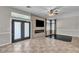 Cozy living room featuring a fireplace and an entertainment area with outdoor access at 3047 Whispering Crest Dr, Henderson, NV 89052