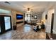 Inviting living room with tile floors, a stone accent wall with fireplace, and ample natural light from large windows at 3047 Whispering Crest Dr, Henderson, NV 89052