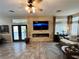 Spacious living room with media wall, fireplace, and comfortable seating at 3047 Whispering Crest Dr, Henderson, NV 89052