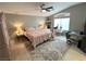 Bright main bedroom with plush decor, a decorative rug, and a cozy, inviting atmosphere at 3047 Whispering Crest Dr, Henderson, NV 89052
