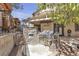 Outdoor kitchen featuring a stainless steel BBQ, stone surround, built in oven, and covered patio for entertaining at 3047 Whispering Crest Dr, Henderson, NV 89052