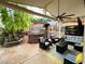 Spacious covered patio area with comfortable seating and outdoor decor at 3047 Whispering Crest Dr, Henderson, NV 89052