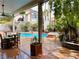 Back patio featuring a dining table with pool and landscape views at 3047 Whispering Crest Dr, Henderson, NV 89052