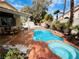 Backyard with a pool, spa, patio, and mature landscaping at 3047 Whispering Crest Dr, Henderson, NV 89052