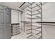 Modern walk-in closet featuring shelving, drawers, and ample storage space at 3047 Whispering Crest Dr, Henderson, NV 89052