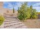 A backyard with tiered landscaping and retaining walls at 324 S Lisbon St, Henderson, NV 89015