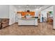 Kitchen featuring tile floors, white appliances, a breakfast bar, and cabinetry at 3335 Wasatch Cedars St, Las Vegas, NV 89122