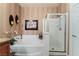 Bathroom featuring a white soaking tub with adjacent glass enclosed shower at 3975 N Hualapai Way # 285, Las Vegas, NV 89129