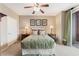 Comfortable bedroom features a queen bed, ceiling fan, and sliding door access to a balcony at 3975 N Hualapai Way # 285, Las Vegas, NV 89129