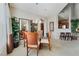 Bright dining area with seating for four, a decorative mirror, and easy access to the kitchen at 3975 N Hualapai Way # 285, Las Vegas, NV 89129