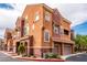 Inviting townhome showcases a tile roof and an attached two-car garage, providing convenience and curb appeal at 3975 N Hualapai Way # 285, Las Vegas, NV 89129