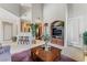 Spacious living room with a built-in entertainment center, modern decor, and a cozy atmosphere for relaxation at 3975 N Hualapai Way # 285, Las Vegas, NV 89129