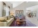 Inviting living room open to the dining area, featuring comfortable seating, natural light, and contemporary decor at 3975 N Hualapai Way # 285, Las Vegas, NV 89129