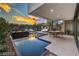 Backyard pool with lounge area, modern design, and scenic sunset views creating a relaxing and luxurious outdoor space at 4077 Heron Fairway Dr, Las Vegas, NV 89141