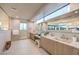 Elegant bathroom showcasing a vanity with dual sinks, a shower, and a large mirror at 4077 Heron Fairway Dr, Las Vegas, NV 89141