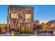 Modern two-story home features a textured facade, manicured landscaping and contemporary architectural design at 4077 Heron Fairway Dr, Las Vegas, NV 89141