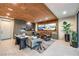 Modern living room showcasing a wood ceiling, sleek cabinetry, and stylish furniture arrangement at 4077 Heron Fairway Dr, Las Vegas, NV 89141