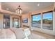 Relaxing main bedroom with fireplace, TV, large windows and natural light at 4077 Heron Fairway Dr, Las Vegas, NV 89141