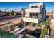 Contemporary home featuring a plunge pool, outdoor seating, and a spiral staircase to the upper floors at 4077 Heron Fairway Dr, Las Vegas, NV 89141