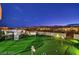 Rooftop deck with putting green, lounge chairs, and panoramic city views providing a luxurious outdoor space at 4077 Heron Fairway Dr, Las Vegas, NV 89141
