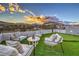 Rooftop deck with putting green, seating area, and scenic mountain views perfect for entertaining and relaxing at 4077 Heron Fairway Dr, Las Vegas, NV 89141