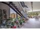 Modern staircase with an adjacent zen garden bringing nature indoors and enhancing the home's tranquility at 4077 Heron Fairway Dr, Las Vegas, NV 89141