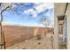 Backyard with gravel, low maintenance desert plants, and a tall brick wall for privacy at 4234 Lunar Canyon Ave, North Las Vegas, NV 89084