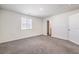 Carpeted bedroom with window and neutral wall paint color at 4234 Lunar Canyon Ave, North Las Vegas, NV 89084