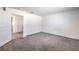Spacious, carpeted bedroom features two doorways and neutral decor at 4234 Lunar Canyon Ave, North Las Vegas, NV 89084