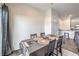 Cozy dining room featuring a decorated table with seating for four and a sliding glass door at 4234 Lunar Canyon Ave, North Las Vegas, NV 89084