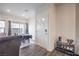 Bright entryway featuring wood floors, a shoe rack, and a dining table at 4234 Lunar Canyon Ave, North Las Vegas, NV 89084