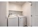 Bright laundry room with modern appliances, providing convenience and functionality at 4234 Lunar Canyon Ave, North Las Vegas, NV 89084