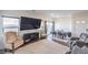 Open-concept living room with a large television and a dining area at 4234 Lunar Canyon Ave, North Las Vegas, NV 89084