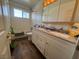 Bright bathroom features double vanity, wood-look floor, and combination tub and shower at 4262 Tarkin Ave, Las Vegas, NV 89120
