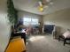 Bedroom featuring a large window with a ceiling fan and natural light at 4262 Tarkin Ave, Las Vegas, NV 89120