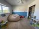 Bedroom with natural light, a beanbag chair, and view of the closet space at 4262 Tarkin Ave, Las Vegas, NV 89120