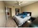 Bedroom with ceiling fan and a glimpse into an adjacent room through an open door at 4262 Tarkin Ave, Las Vegas, NV 89120