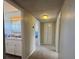 Hallway view, with a bathroom on the left and a bedroom at the end of the hall at 4262 Tarkin Ave, Las Vegas, NV 89120