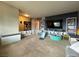 Spacious carpeted living area with dark accent wall at 4262 Tarkin Ave, Las Vegas, NV 89120