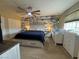 Main bedroom with a accent wall and ceiling fan at 4262 Tarkin Ave, Las Vegas, NV 89120