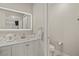 Bathroom featuring a modern vanity, illuminated mirror and a separate toilet room at 4689 Kristen Ln, Las Vegas, NV 89121
