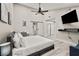 Bright bedroom featuring a modern bed, desk and an adjacent seating area at 4689 Kristen Ln, Las Vegas, NV 89121