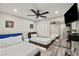Stylish bedroom featuring two twin beds, a ceiling fan and mirrored closet at 4689 Kristen Ln, Las Vegas, NV 89121