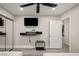 Bedroom featuring TV, a black overhead fan and a mirror closet at 4689 Kristen Ln, Las Vegas, NV 89121