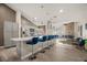 Contemporary kitchen with an island bar, stainless steel appliances, and an adjoining dining area at 4689 Kristen Ln, Las Vegas, NV 89121