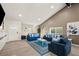 Open-concept living room with modern decor, comfortable seating, and a bright, airy atmosphere at 4689 Kristen Ln, Las Vegas, NV 89121